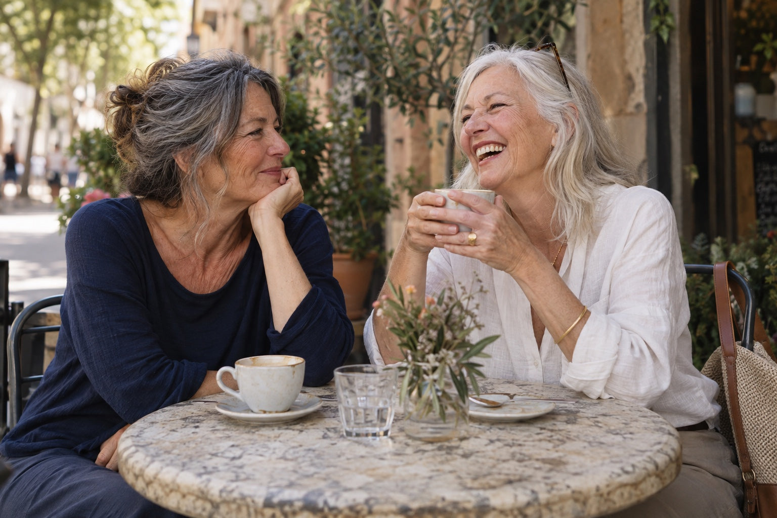 Illustrative scene of two friends enjoying a cafe conversation