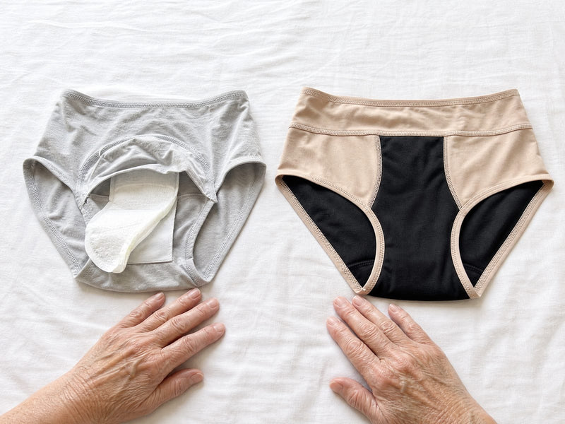 Side by side: a grey pair with a loose pad slipping out of its pocket next to a beige pair of Haven with its black layers sewn in